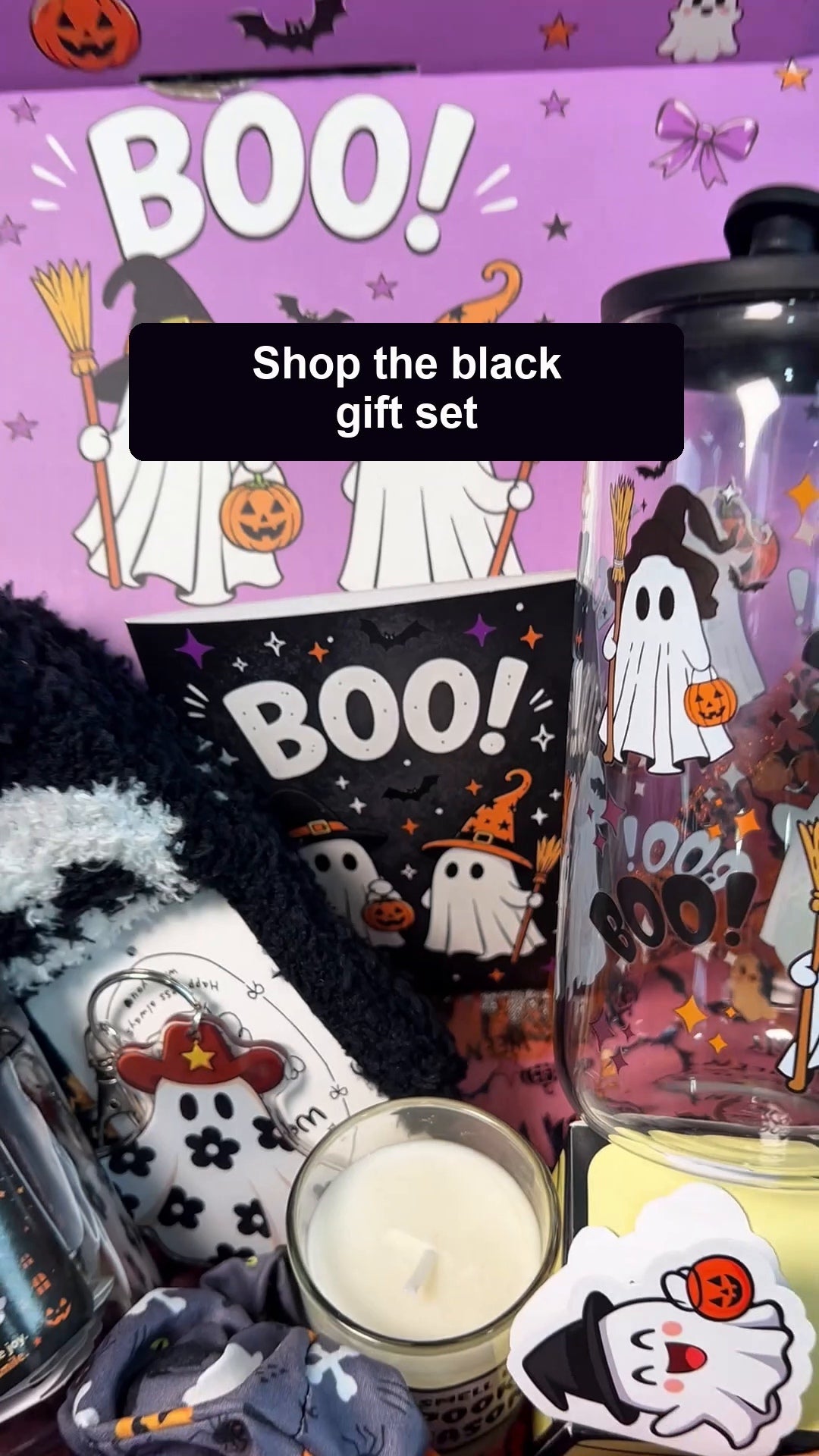 Unboxing the ANOTION black Halloween Boo Basket gift set, removing the tissue wrapping and showing its included gifts.