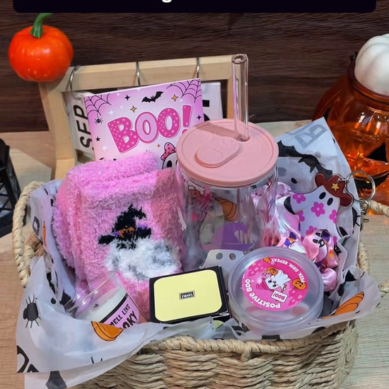 ANOTION pink Halloween Boo Basket gift set styled in a display basket. Basket styling shown; gift set arrives boxed. Wicker basket and decor are display props.