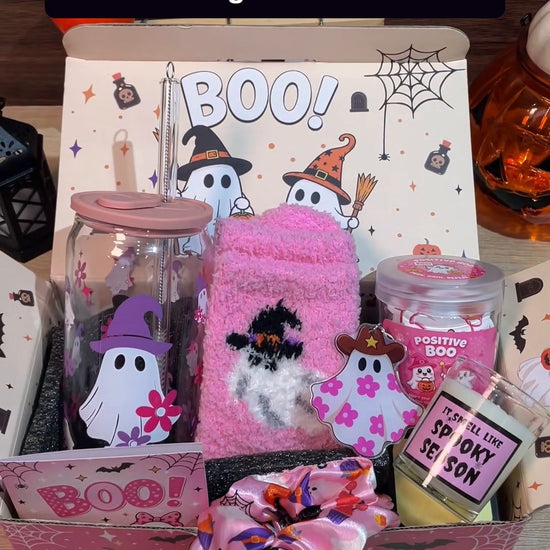 Unboxing the ANOTION pink Halloween Boo Basket gift set and showing its included gifts in the box.